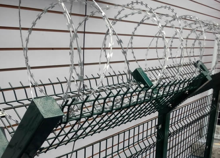 Barbed Tape Coils Used as Security Fence Toppings